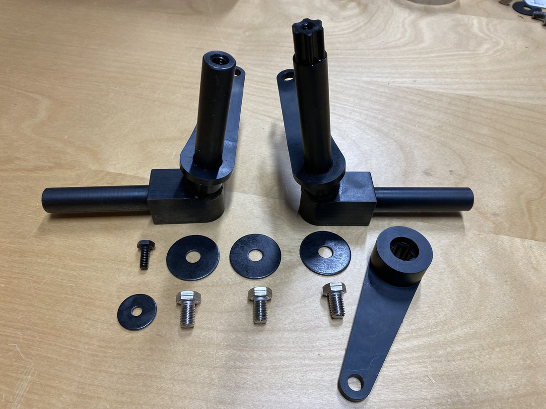 A complete black-oxide MF1025 set: two knuckles, drag arm, washers and cap screws